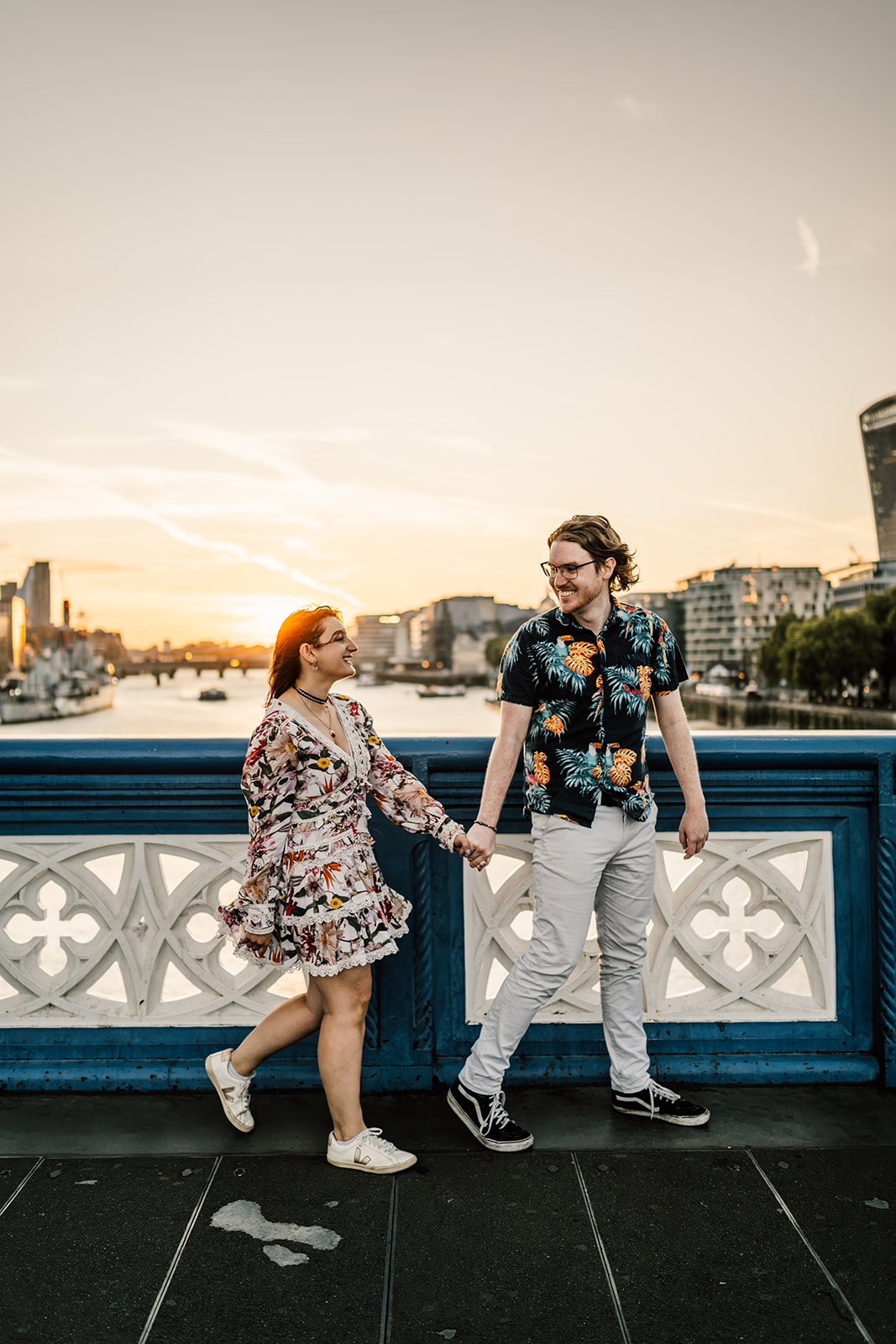 Tiryon and Isobel walking together across Tower Bridge